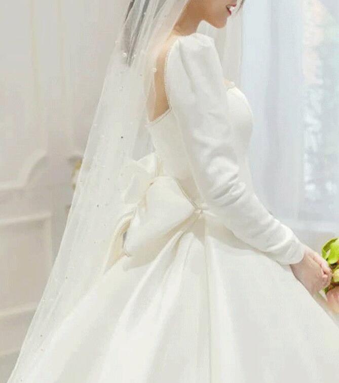 French satin light wedding dress 2022 New main wedding dress big tail cover thick arms long sleeves spring out yarn