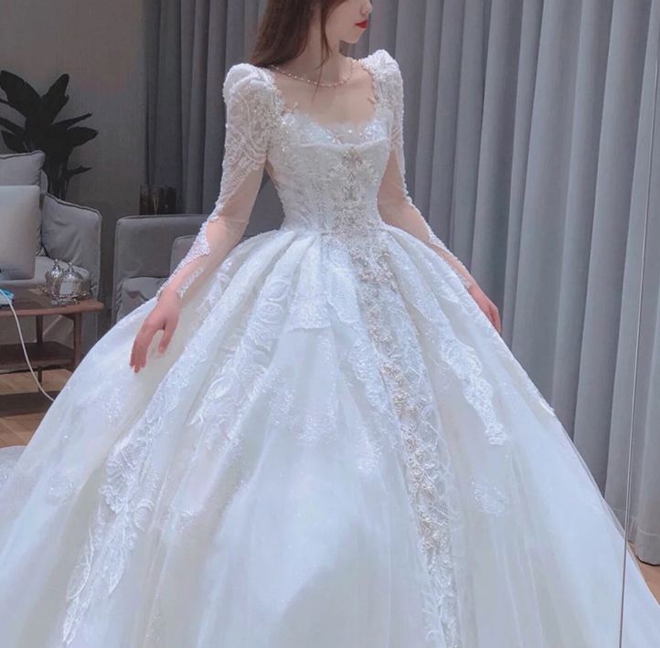 Long trailing wedding dress princess dress lace dress handmade Light main wedding dress 2022 new bride French long sleeves heavy heavy heavy tail simple slim super fairy